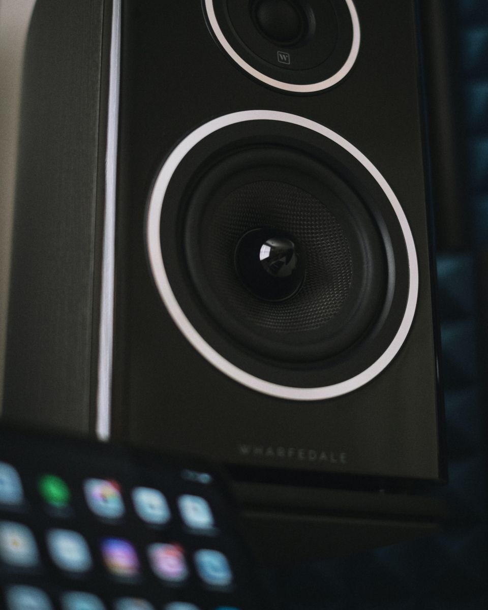 black and gray speaker with blue light
